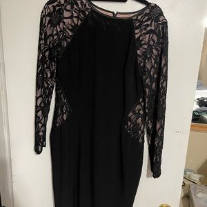 Black dress, stretchy and zip up on the back.